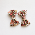 Set of two floral fabric bow hair clips for girls with pink and green flower print