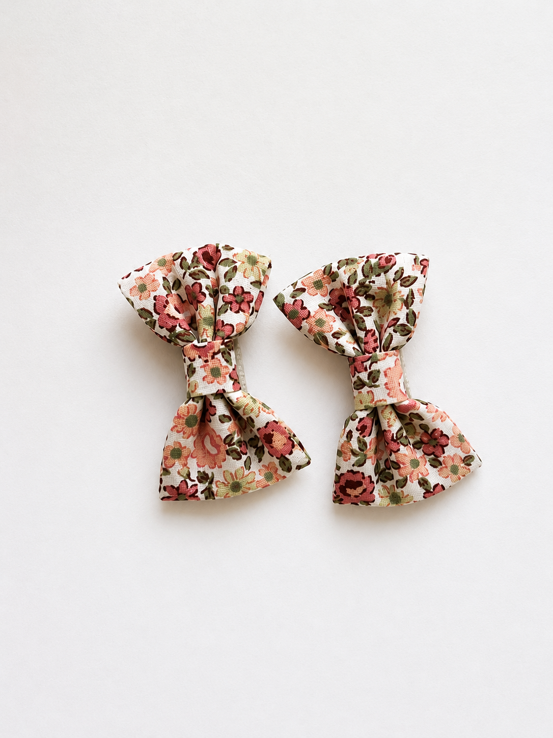 Set of two floral fabric bow hair clips for girls with pink and green flower print